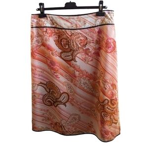 Pierre Cardin Femme skirt fully lined.  Tangerine colour with Paisley print